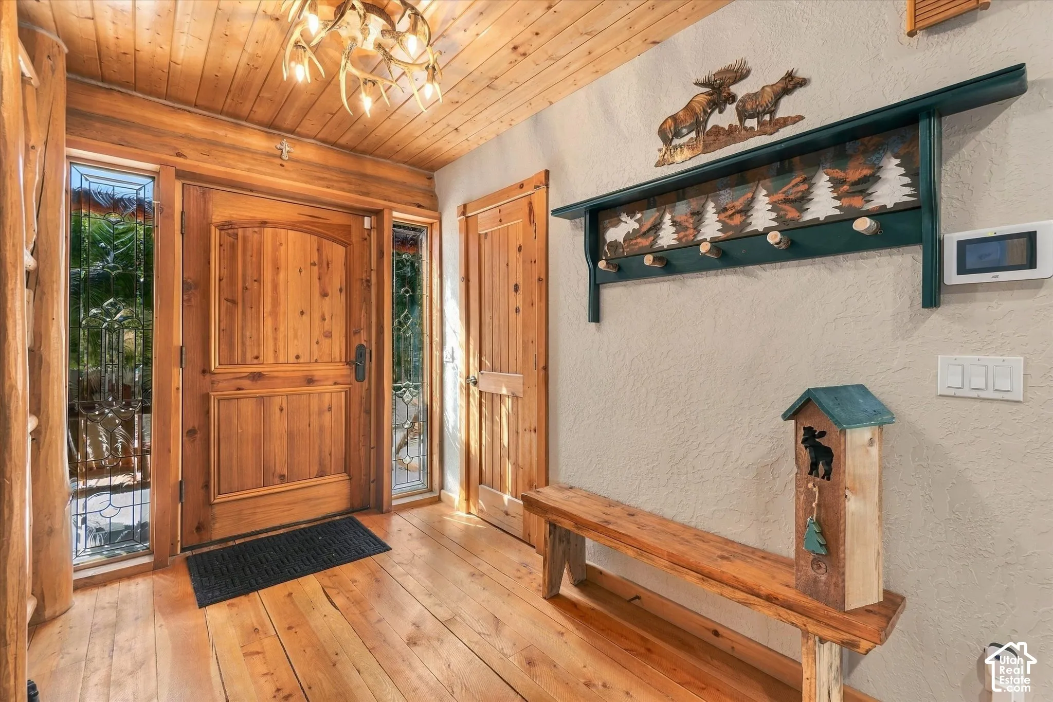 Solid wood entry door with decorative glass sidelights