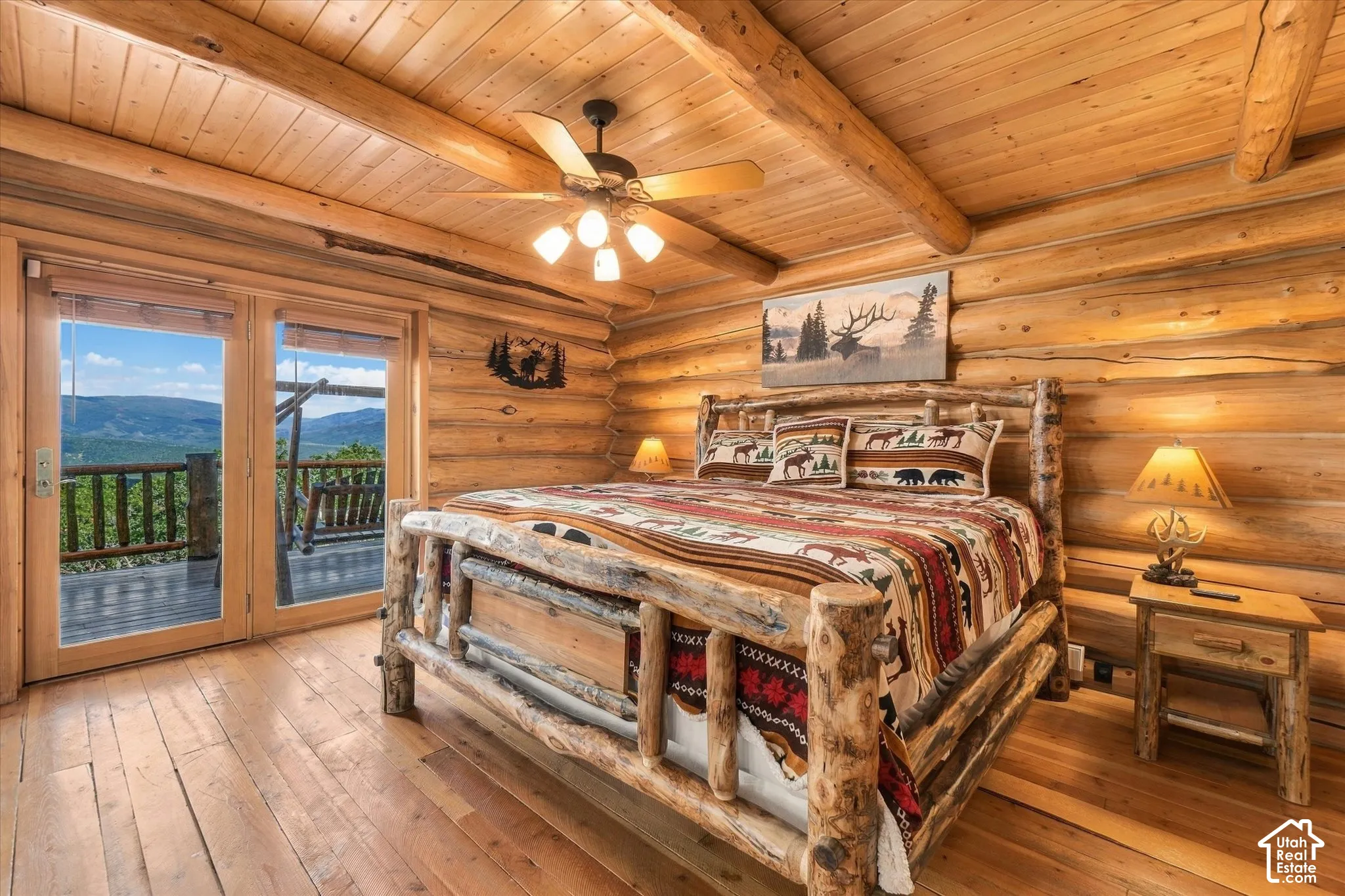 Wood-paneled walls and ceiling with exposed log beams