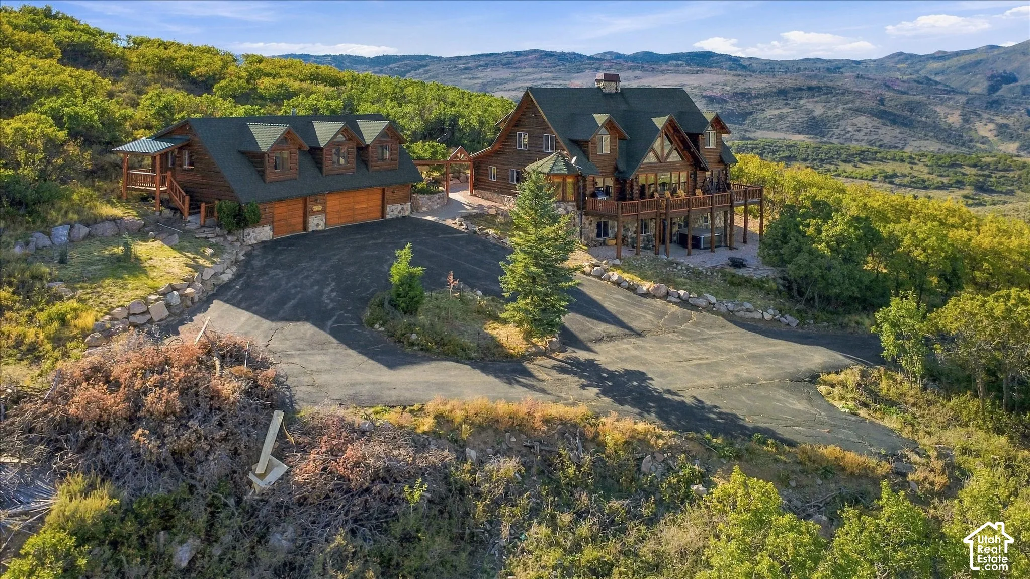 Log cabin-style residence featuring multiple balconies and dormer windows