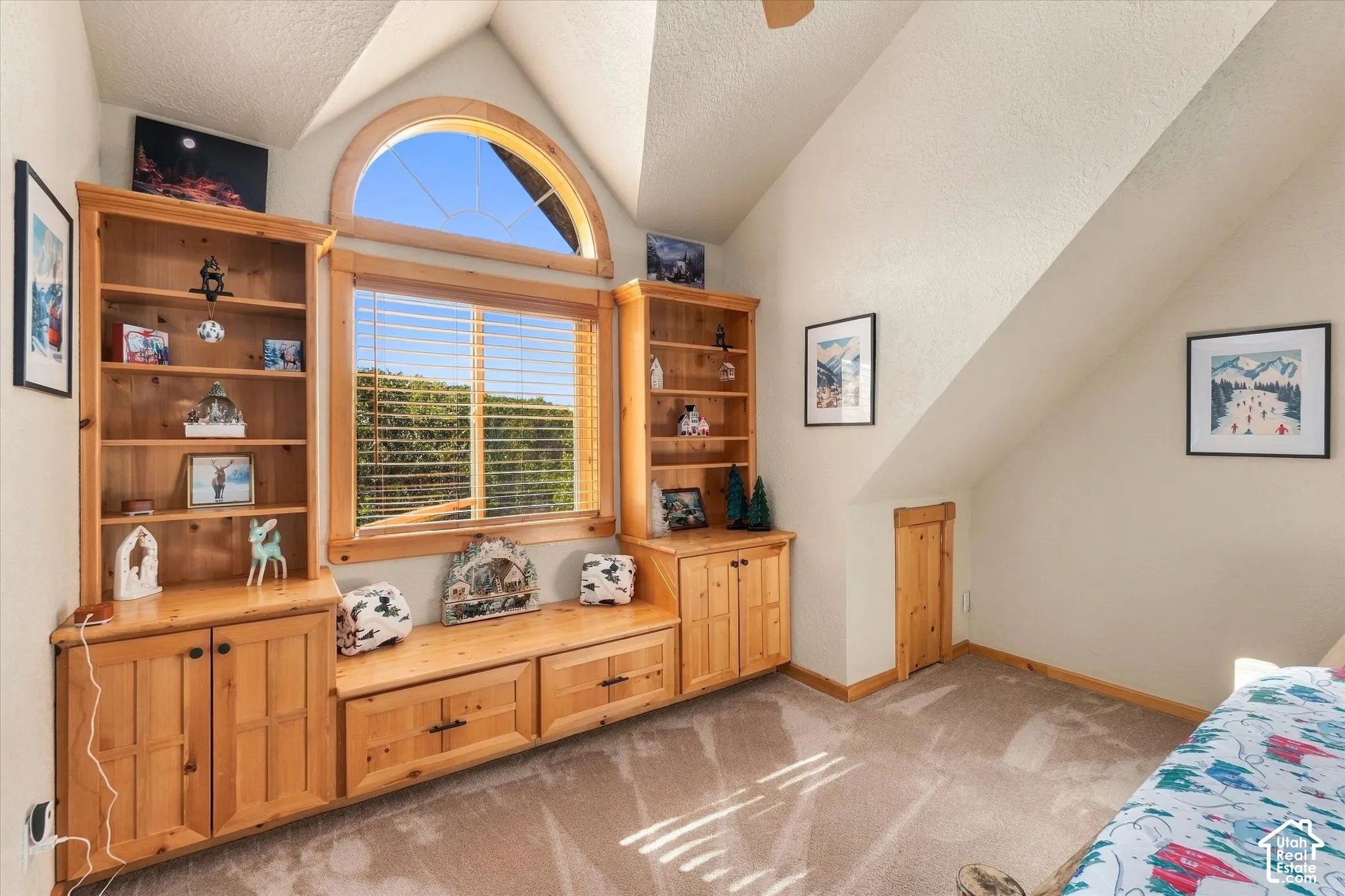 Built-in shelving, integrated window bench, and a curved arch window with an additional rectangular window