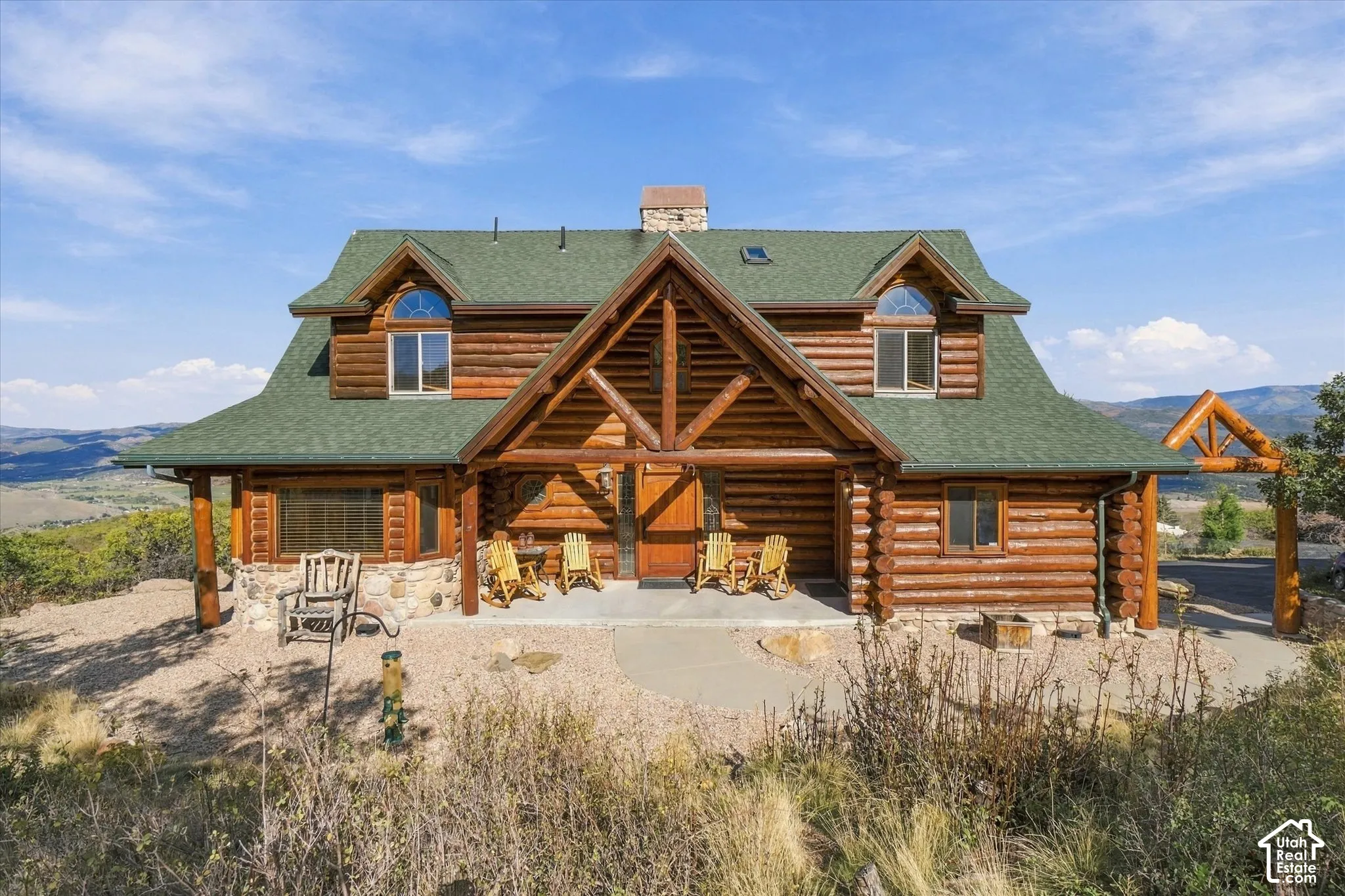 Log cabin exterior with a prominent A-frame entry
