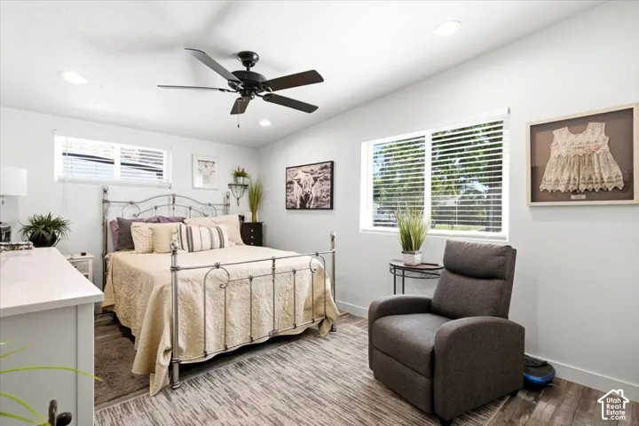 Recessed lighting, ceiling fan, wood-finish flooring, multiple windows, window blinds