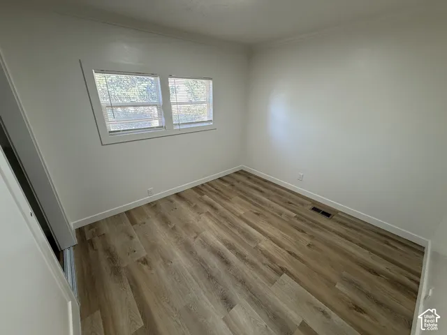 Wood-finish flooring and white painted walls