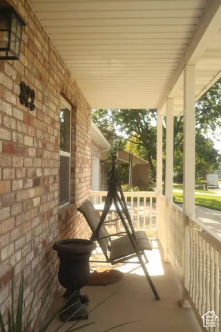 Brick exterior with a covered porch