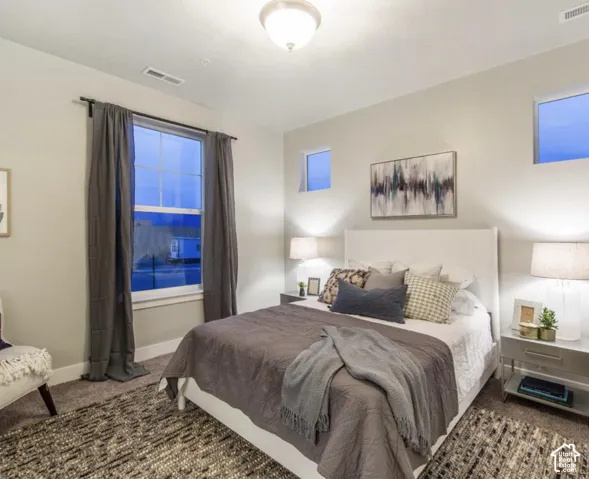 Recessed lighting, large window with natural light, two high transom windows, and wall-to-wall carpeting