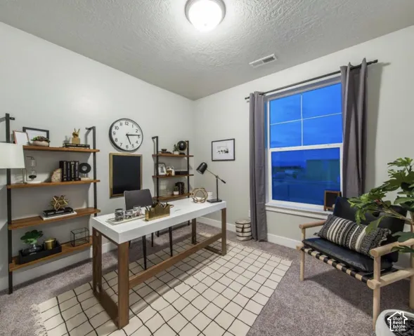 Carpeted flooring, recessed lighting, and a large window with curtain rods