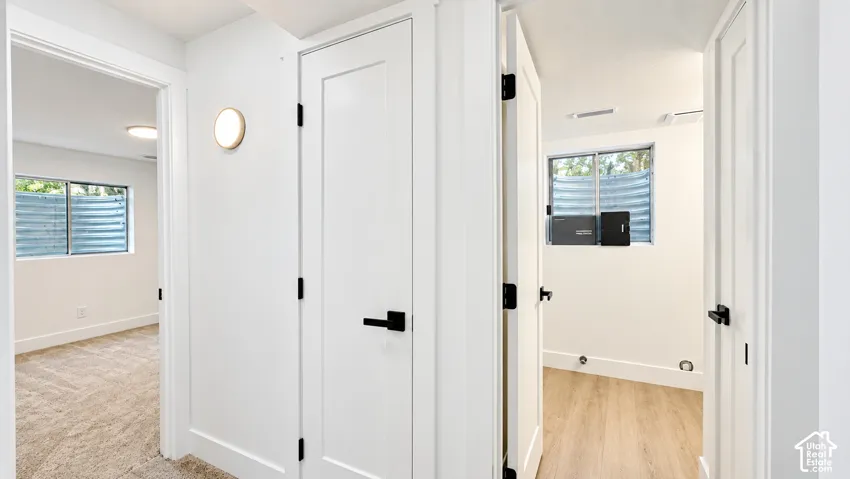 Crisp white walls with modern black hardware