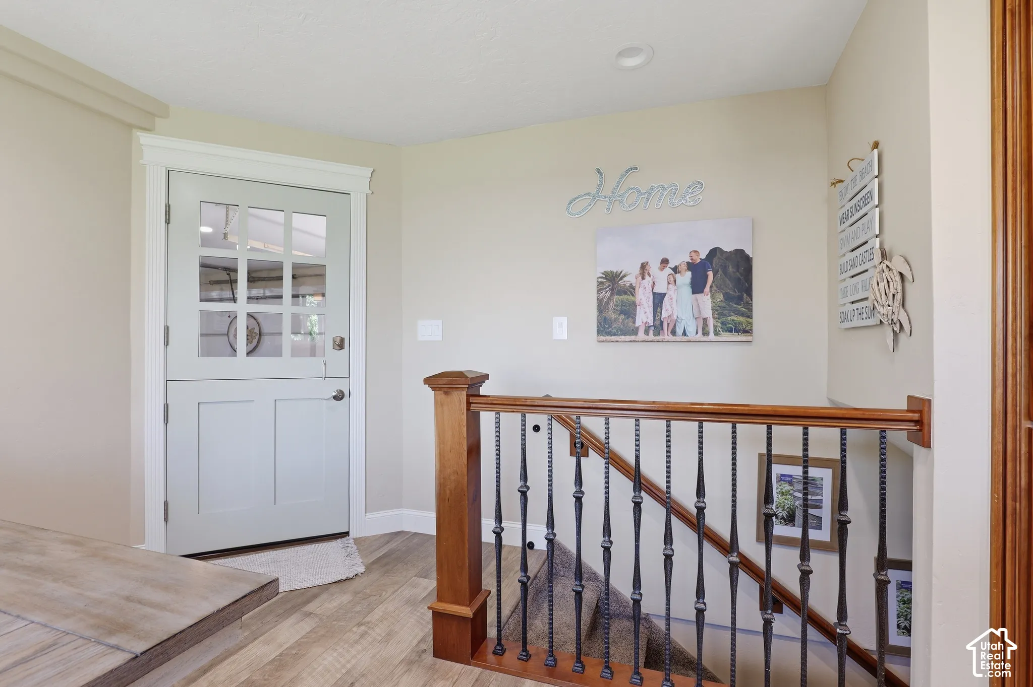 Wood-finish flooring with a decorative half-door featuring upper glass panels