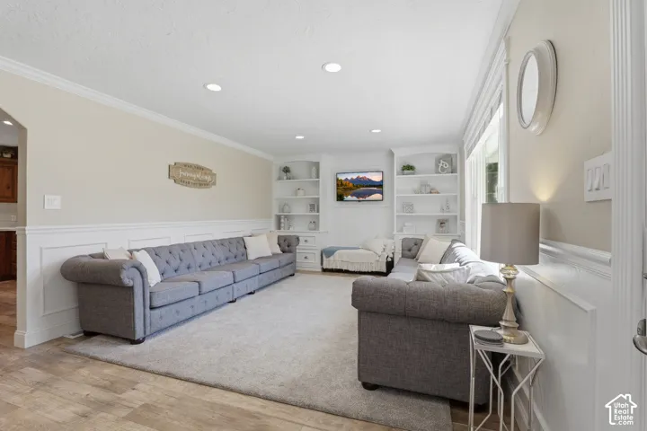 Recessed lighting, crown molding, and wainscoting details