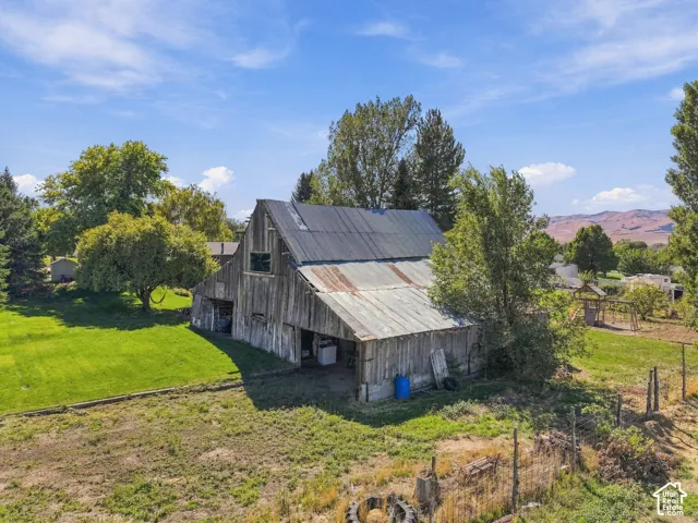 Barn structure featuring wood siding and a corrugated metal roof