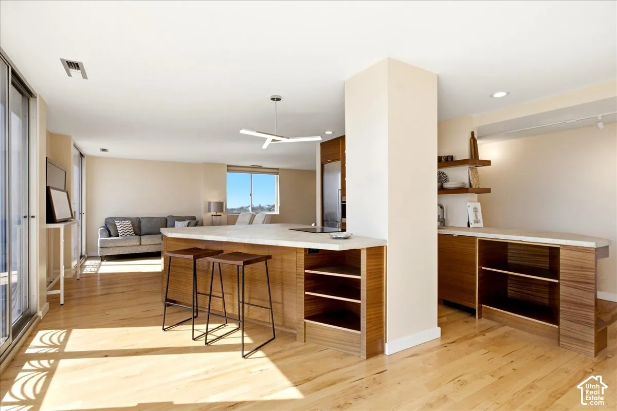 Kitchen with breakfast bar with massive south facing views of the valley and Wasatch mountains