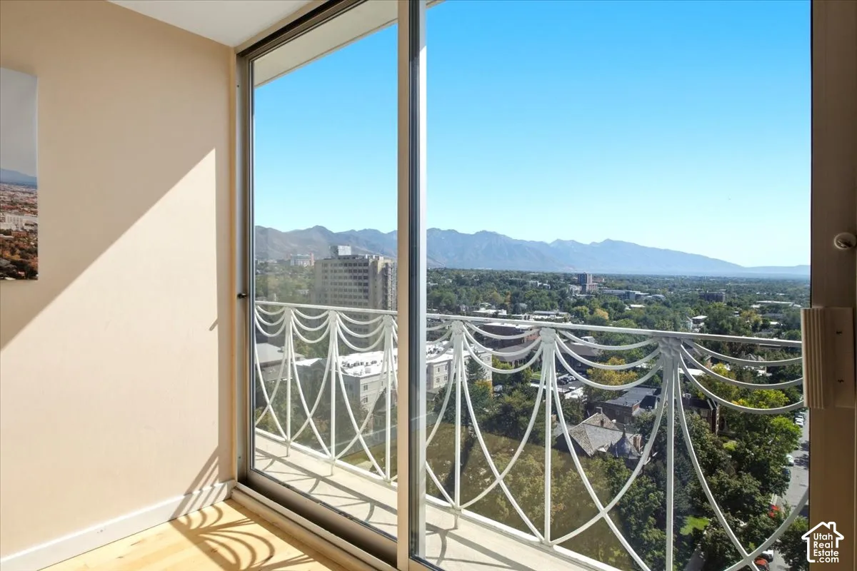 Sliding glass door to Juliette balcony, decorative metal railing that looks like it should be on a wedding cake.