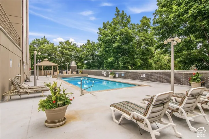 Outdoor swimming pool with integrated steps, surrounded by a concrete deck