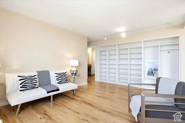 This area was the second bedroom and was opened up as a library/music room/office. Wall can easily be installed for 2nd bedroom again. Nice built-in shelvi