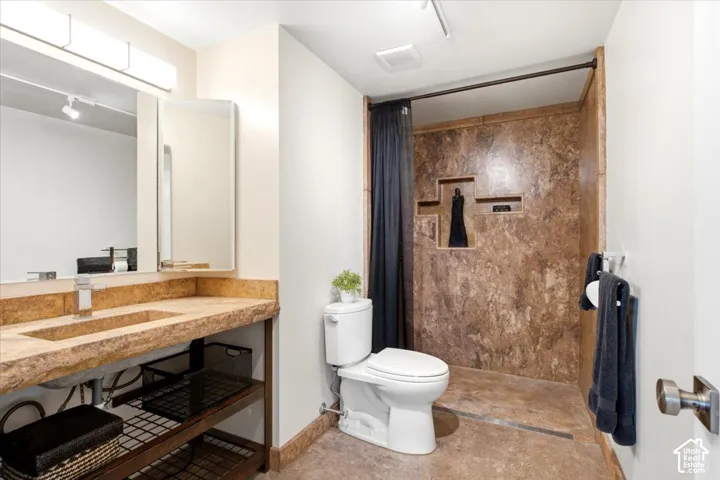 Double vanity with integrated sinks and stone-finish countertop