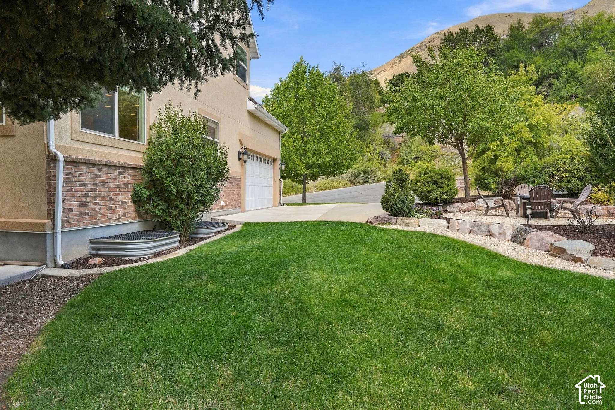 Stucco and brick exterior with a two-car garage