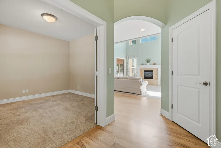 Archway entry with wood-finish flooring