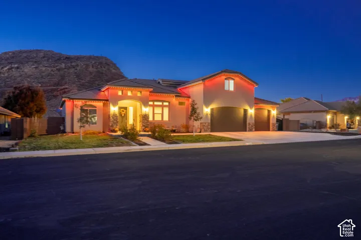 Stucco exterior with stone accents and an arched entry