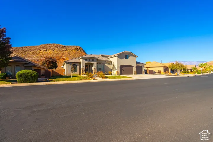 Stucco exterior with stone accents and an arched entry