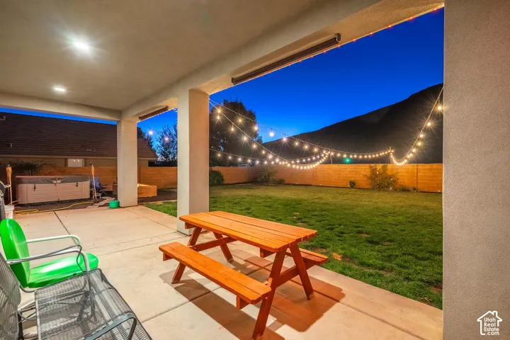 Covered patio with recessed lighting, concrete flooring, string lighting, and a fenced backyard