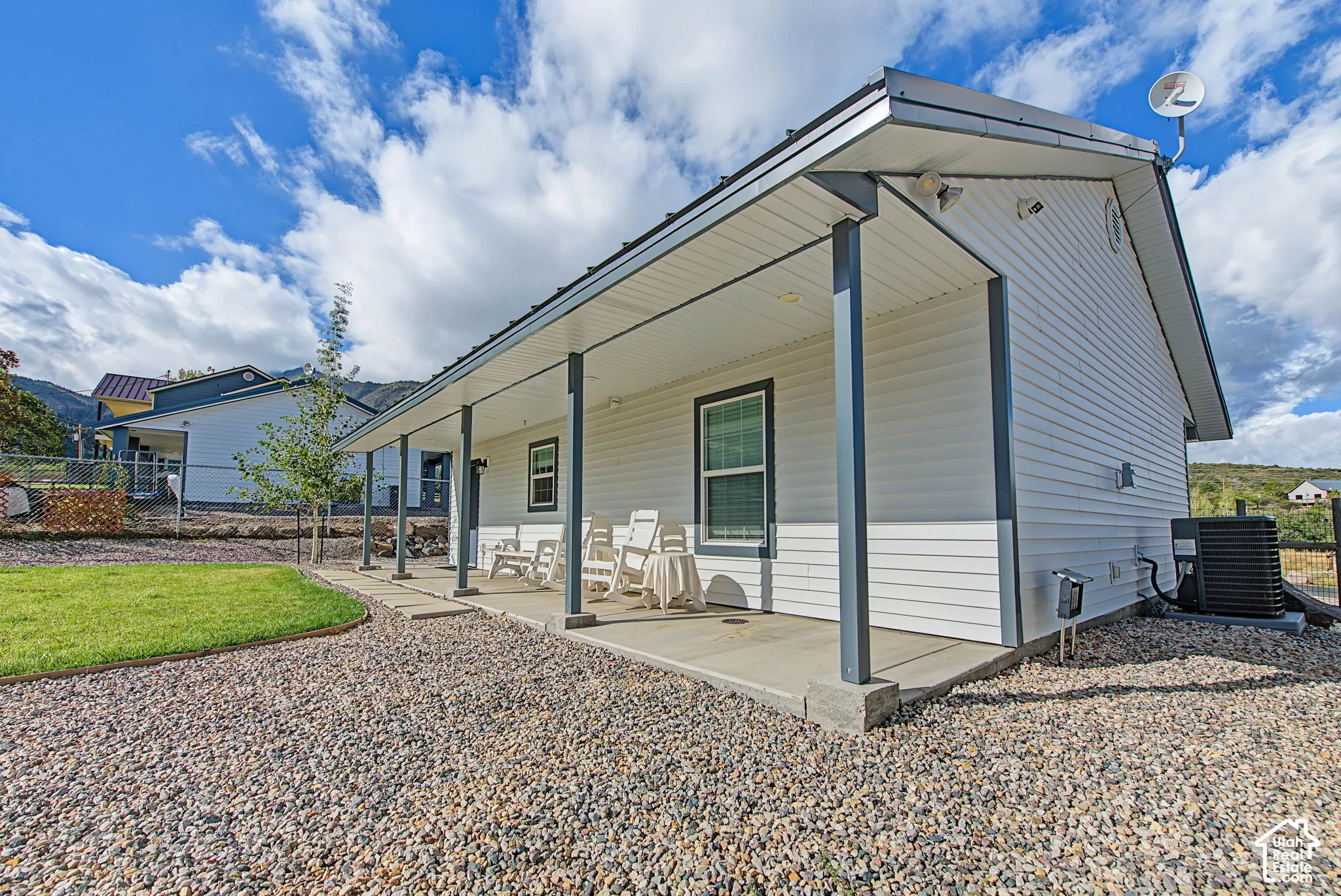 Covered porch with concrete flooring and white siding exterior