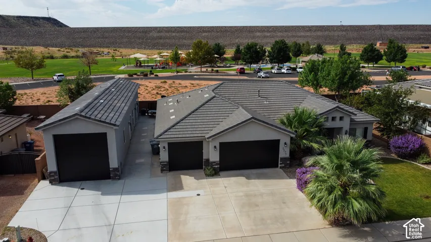 Single-story residence featuring a two-car garage, an additional detached garage, and a concrete driveway