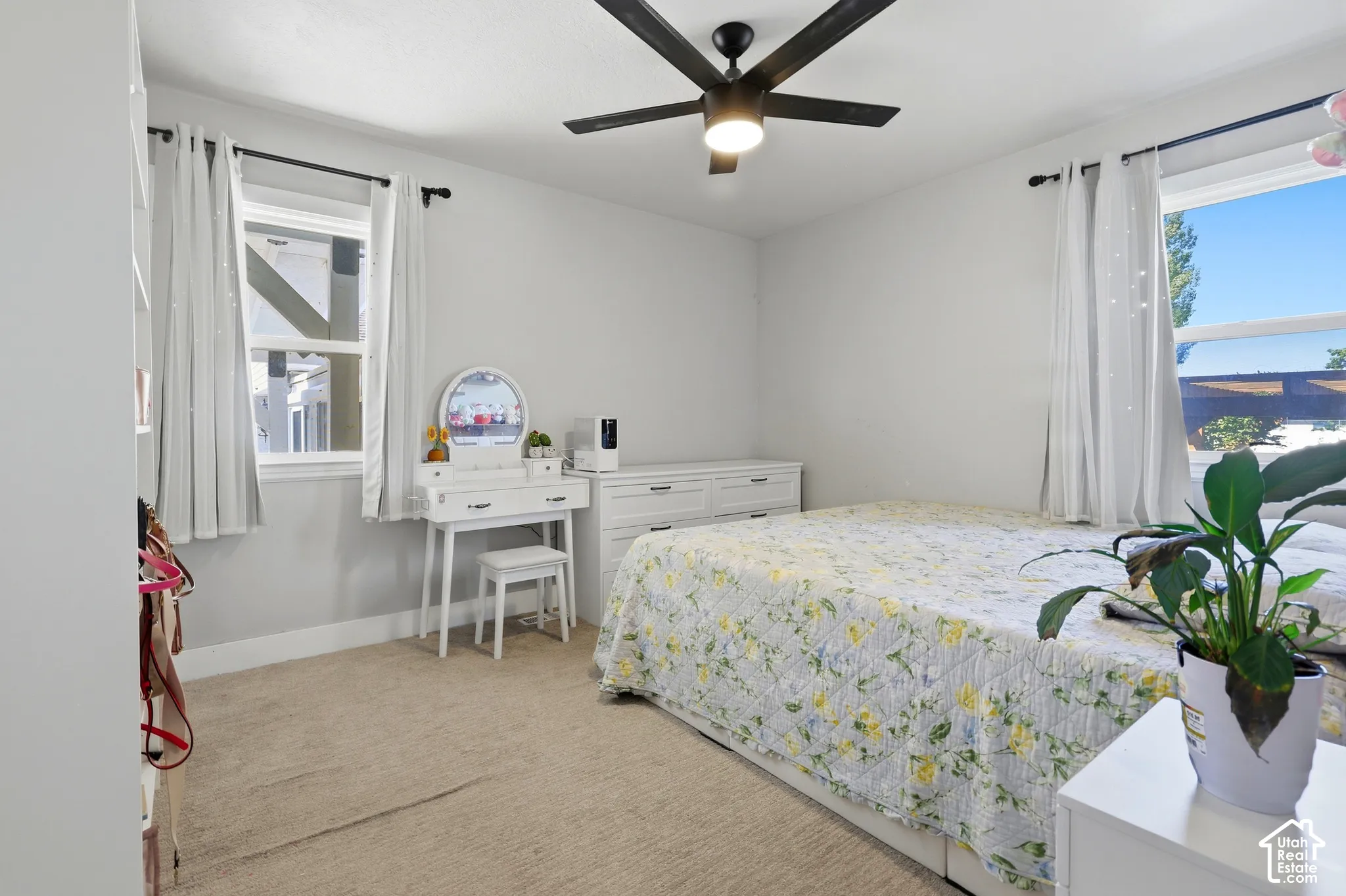 Recessed lighting, ceiling fan with light, and multiple windows