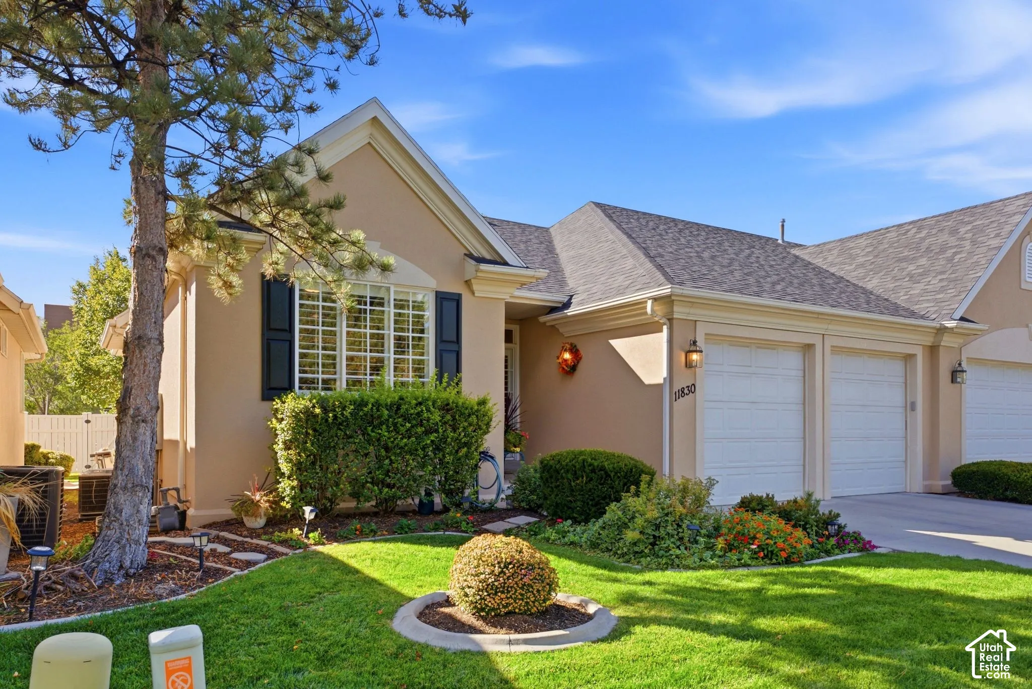 Stucco exterior with a pitched roof