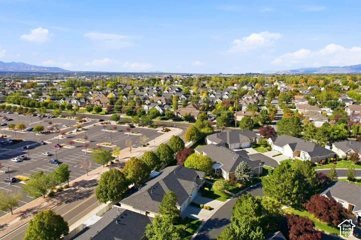 Residential neighborhood featuring established trees and a distant mountain range