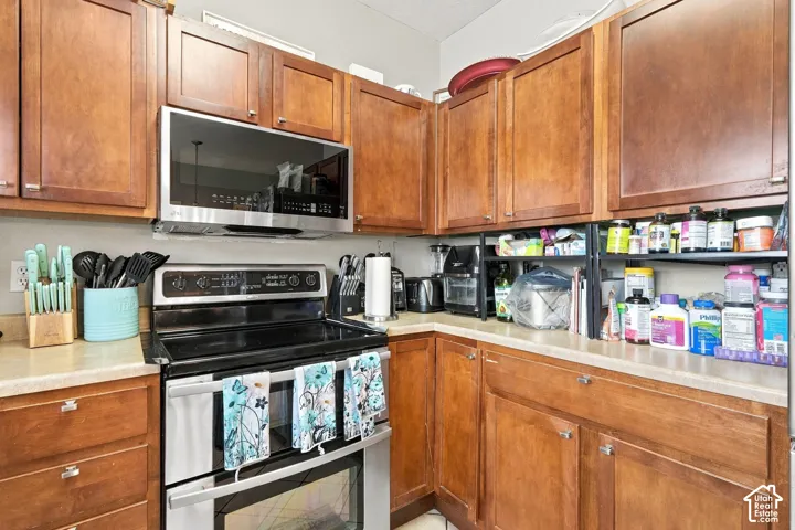 Wood-finish cabinetry paired with light-toned countertops