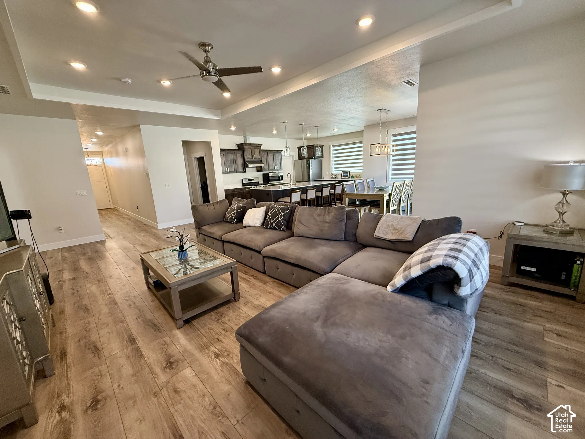 Recessed lighting, ceiling fan, wood-finish flooring, and an open-concept layout