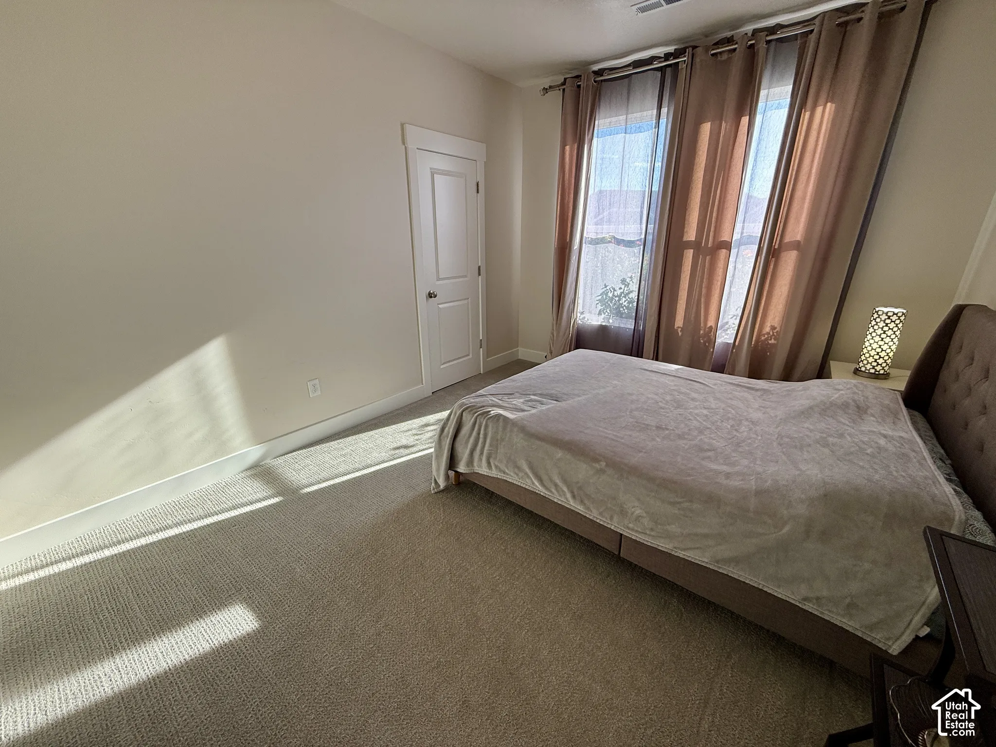 Light-toned carpeting and walls