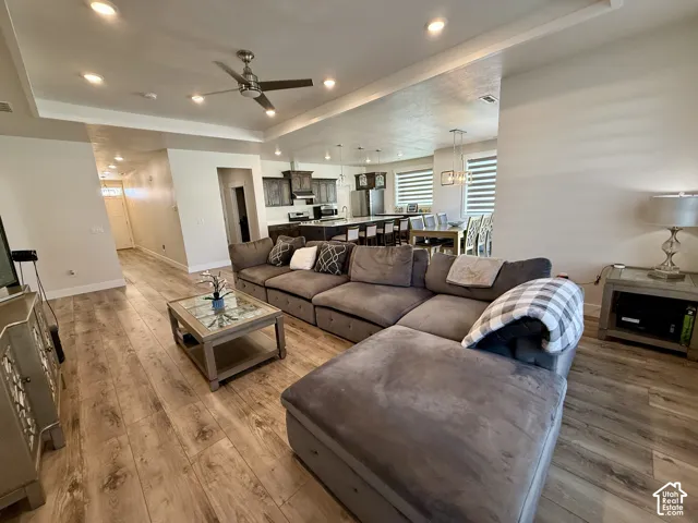 Recessed lighting, ceiling fan, wood-finish flooring, and an open-concept layout