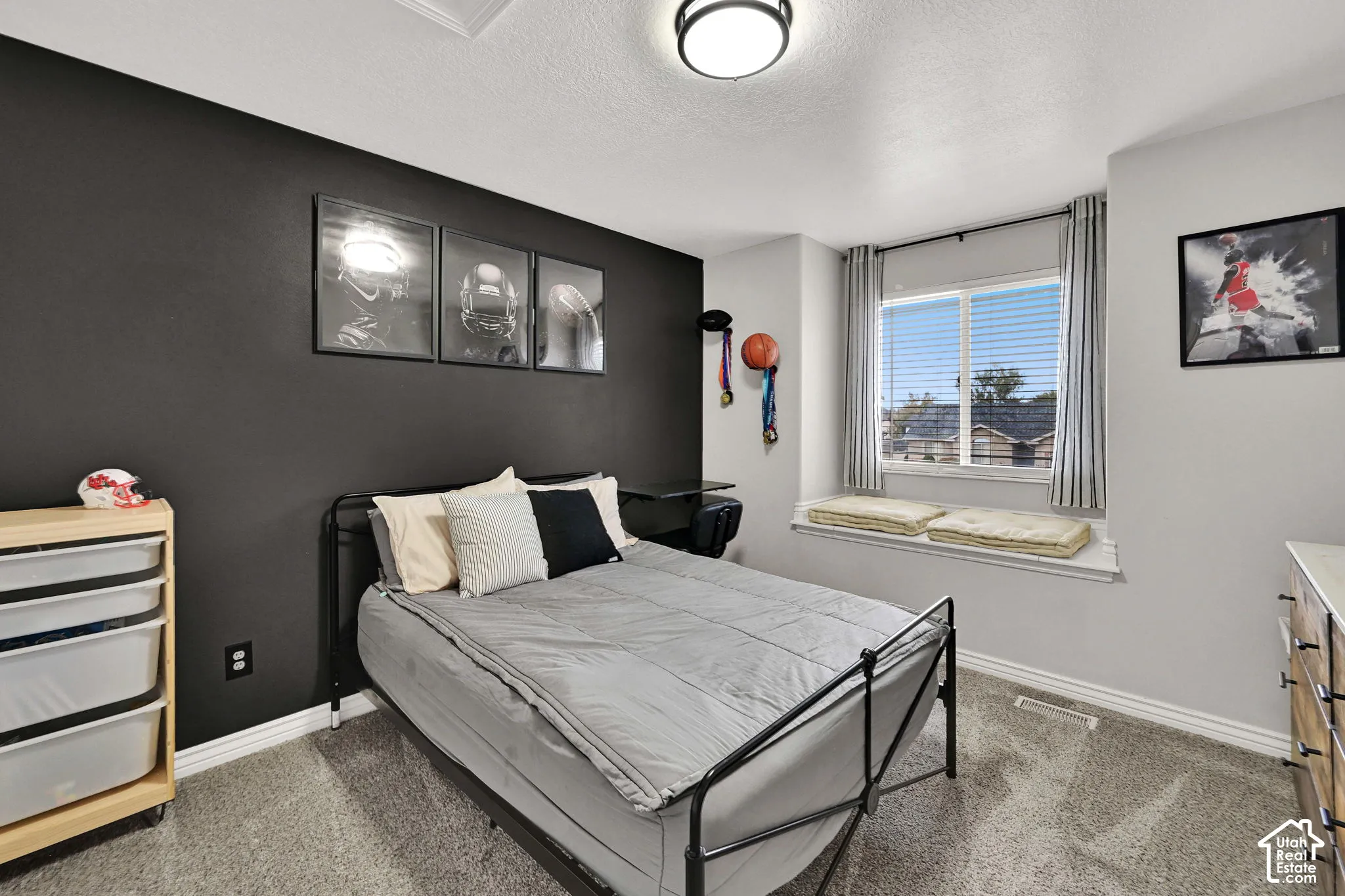 Accent wall with dark finish and a built-in window bench