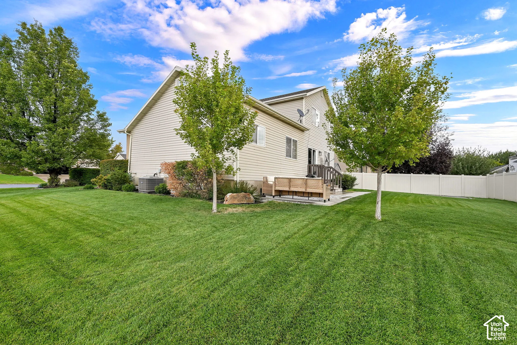 Expansive lawn area with mature trees