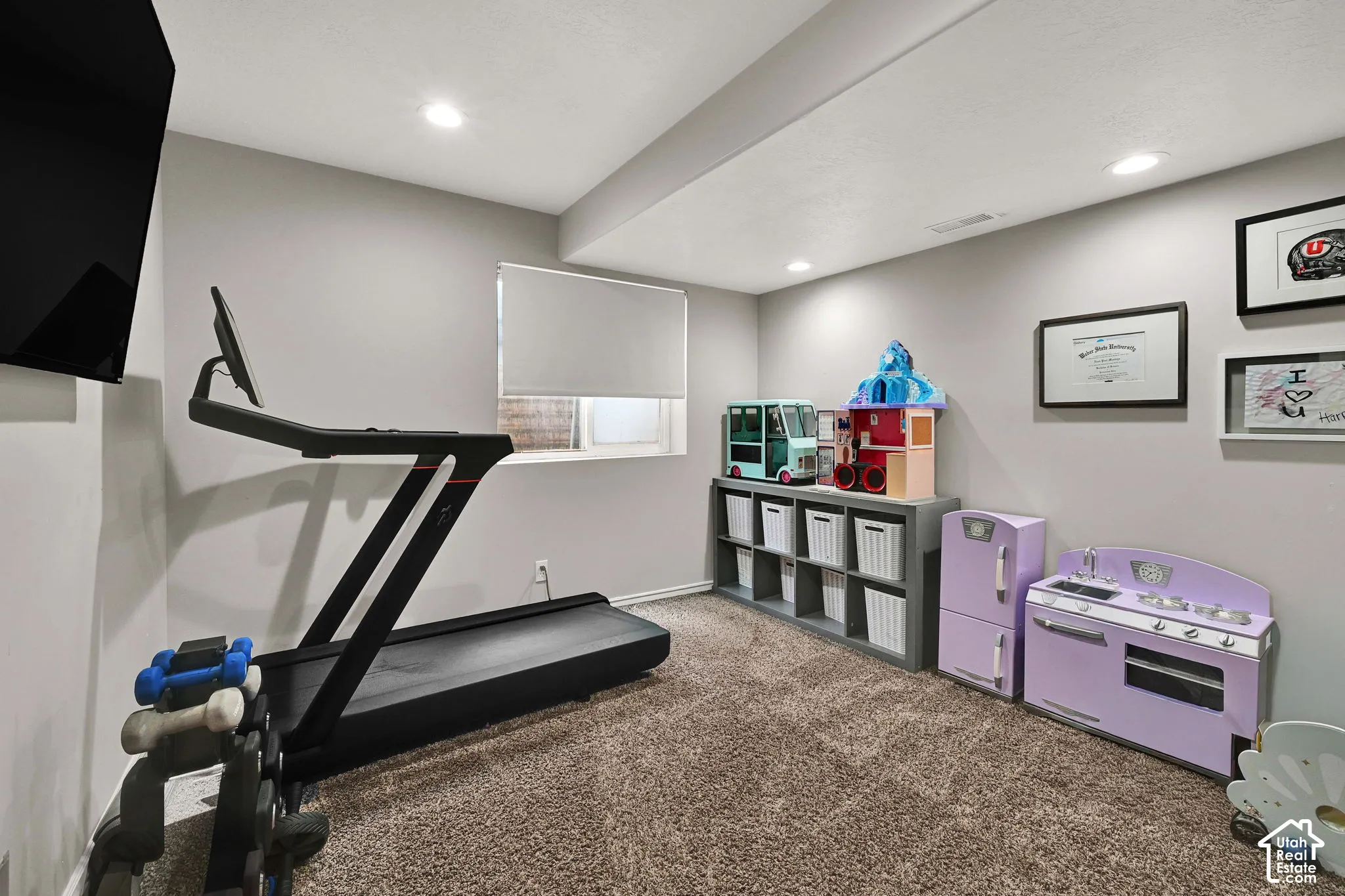Bedroom with recessed lighting and roller shade