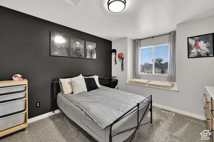 Accent wall with dark finish and a built-in window bench