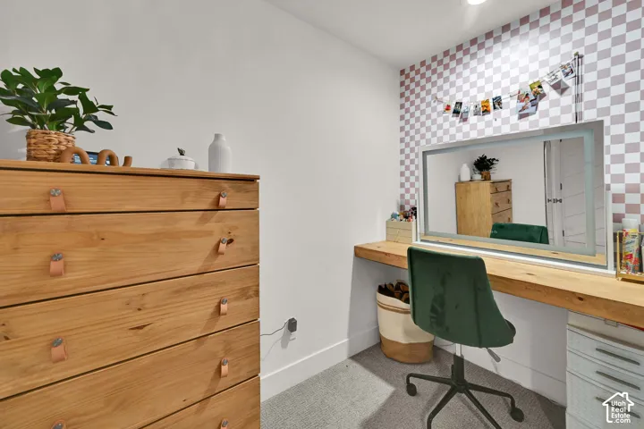 Built-in wood-finish desk with an integrated illuminated mirror