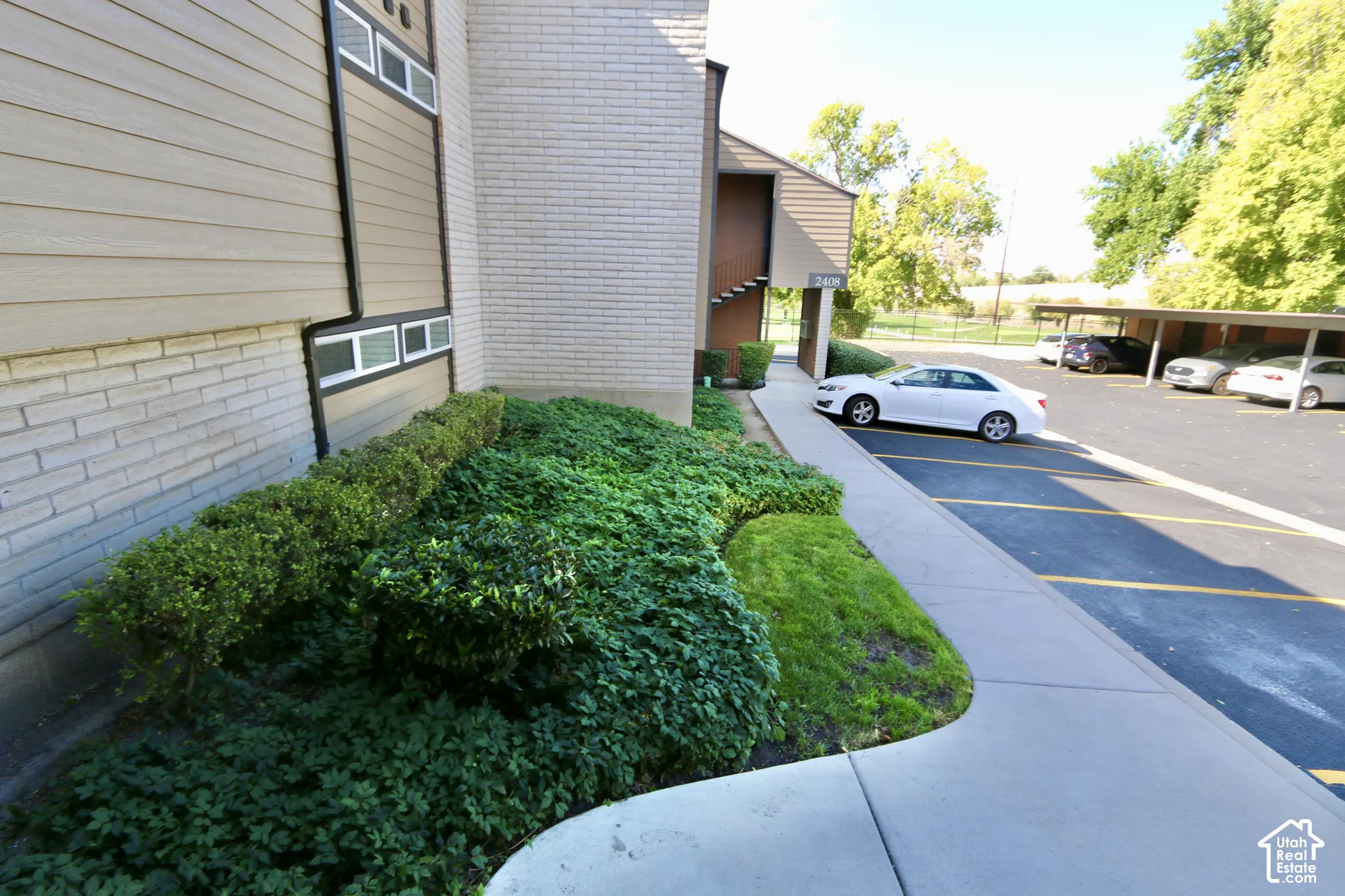 Building exterior showing covered and uncovered parking