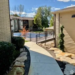 Clubhouse and pool area with rock landscaping