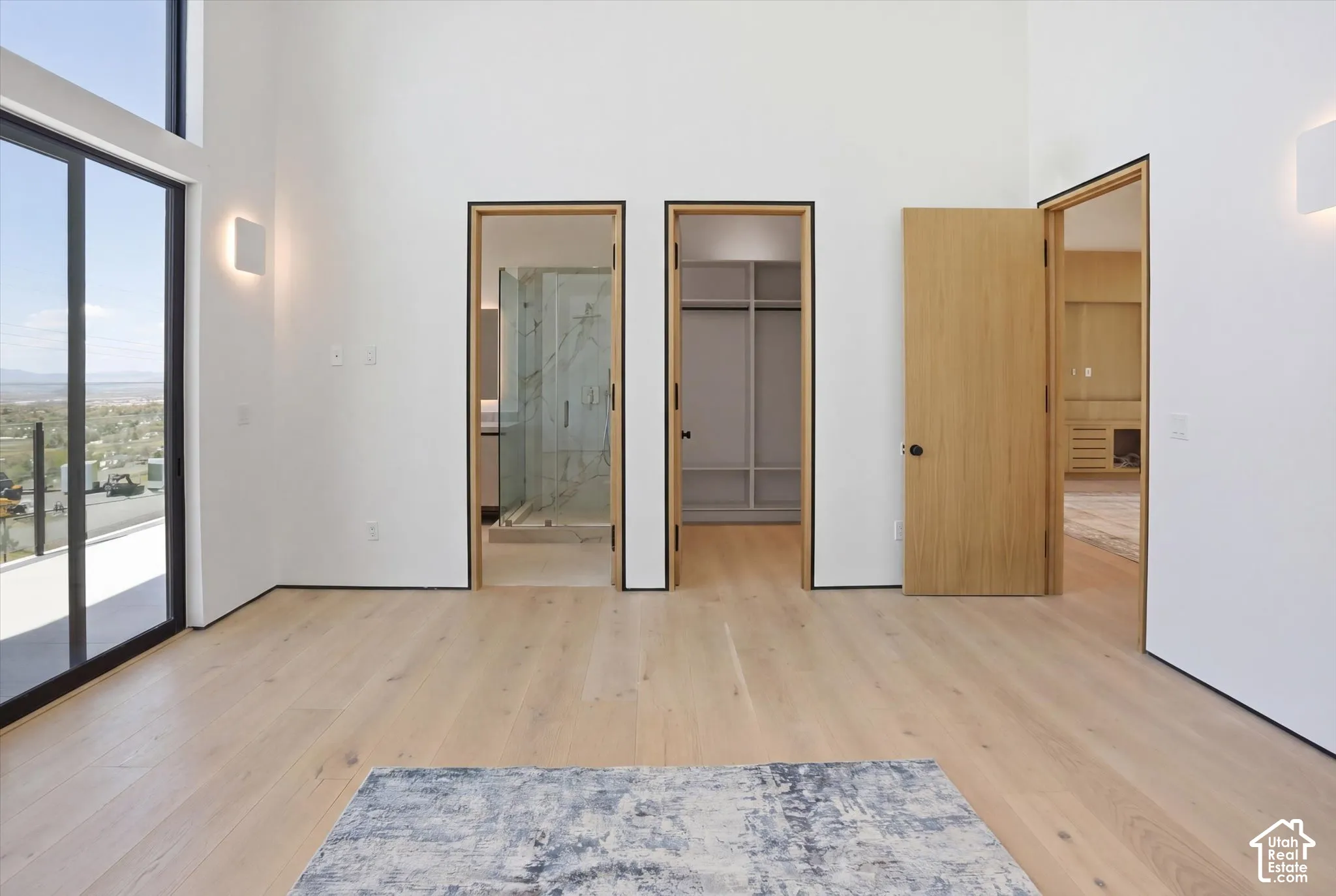 Secondary bedroom 1: East facing balcony access with onsuite bathroom and walk in closet