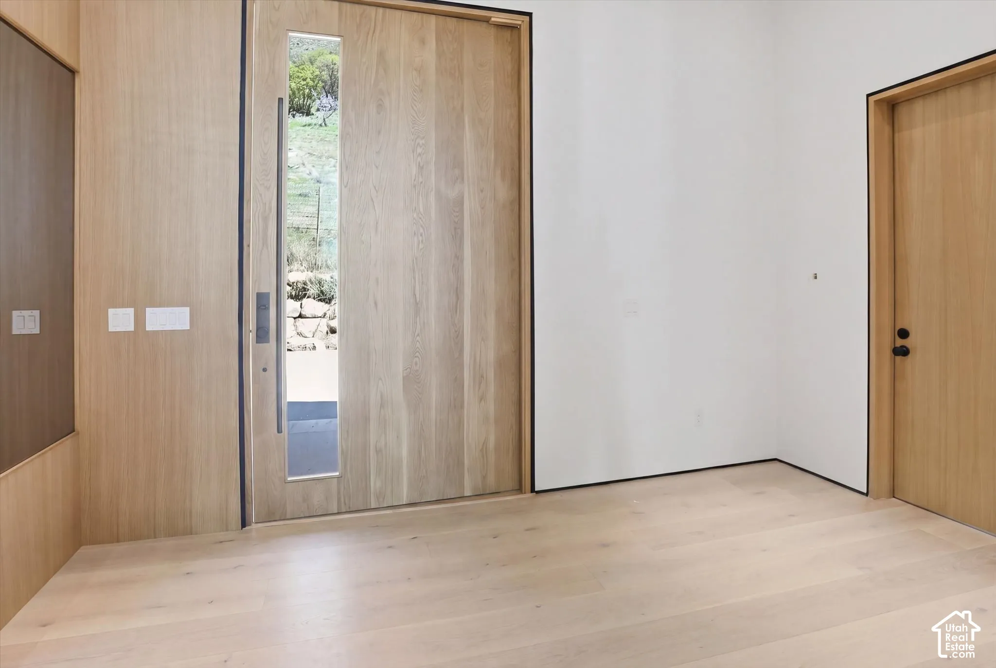 Stunning foyer with solid wood doors on both sides