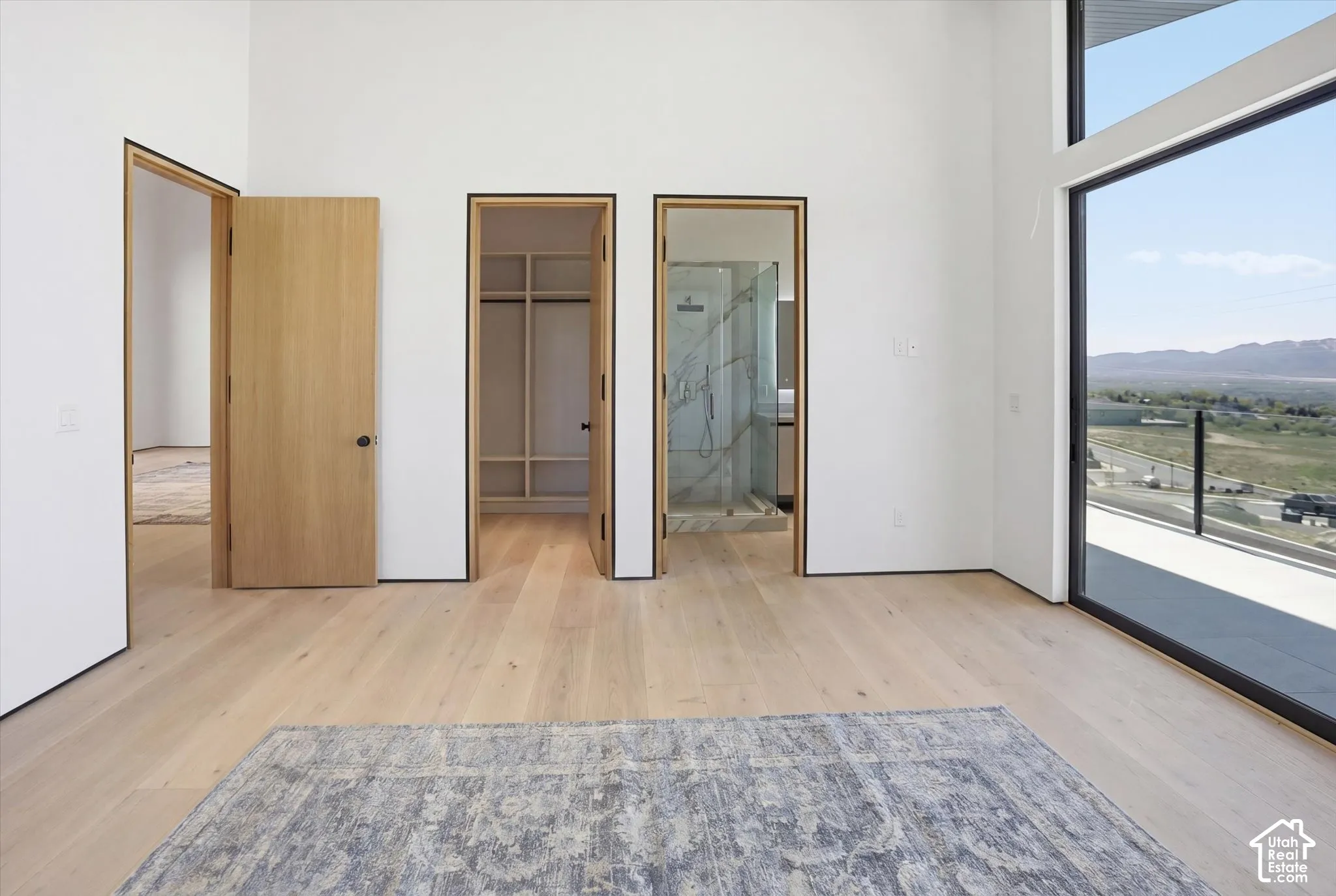 Secondary Bedroom 2: East facing balcony access with on suite bathroom and walk in closet