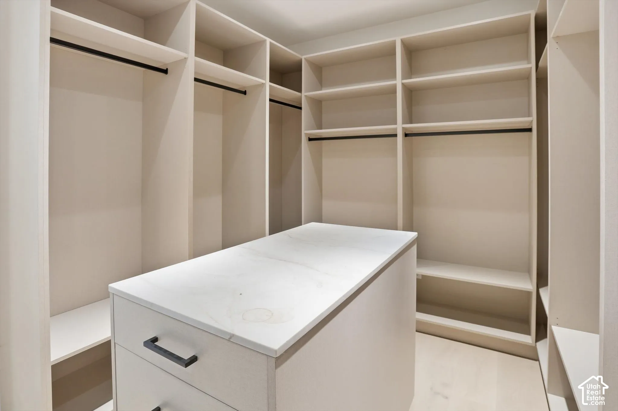 Ample room and organization in this primary suite walk in closet