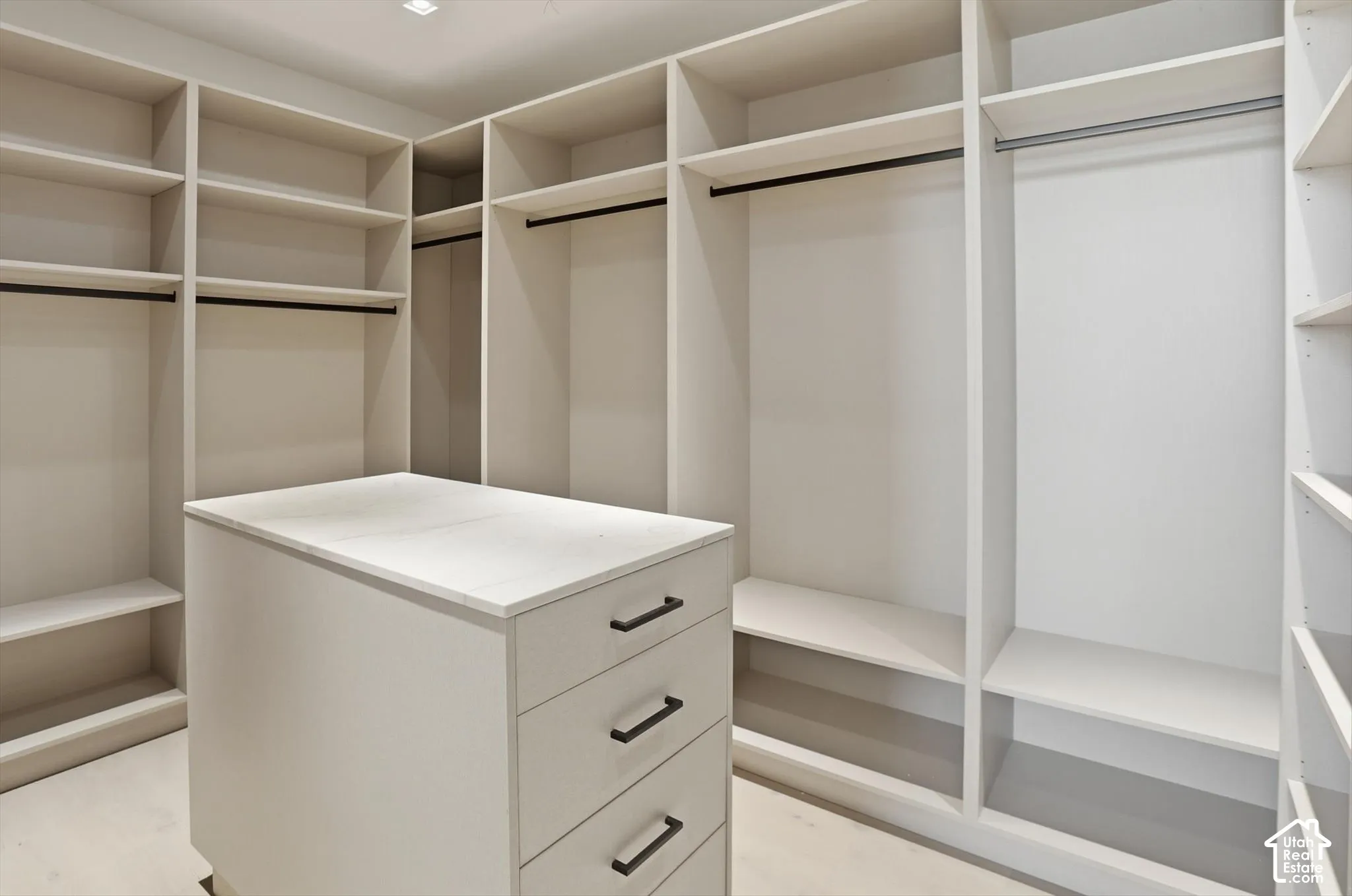 Custom closet built in’s in primary suite walk in closet