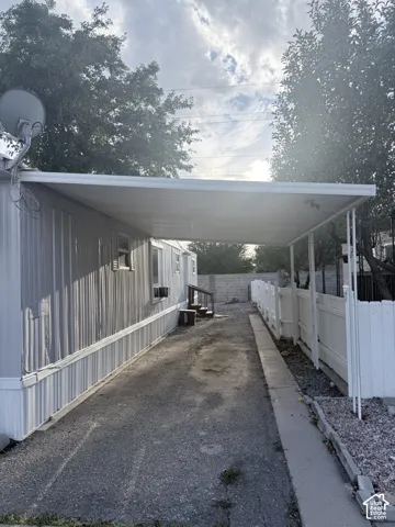 Carport structure providing sheltered parking
