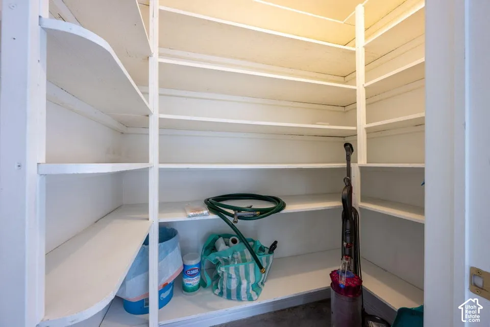 Built-in white shelving system featuring multiple storage tiers