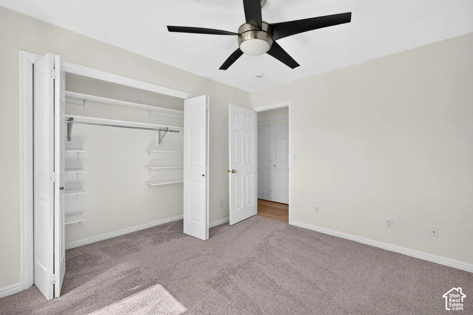 Neutral-toned walls complement plush carpeting