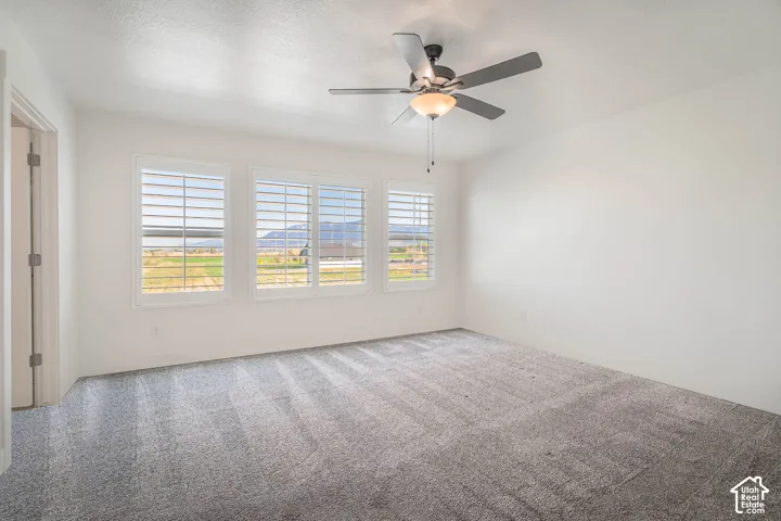 Primary bedroom with digitally altered carpet.