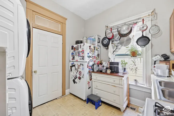 Stacked white laundry appliances